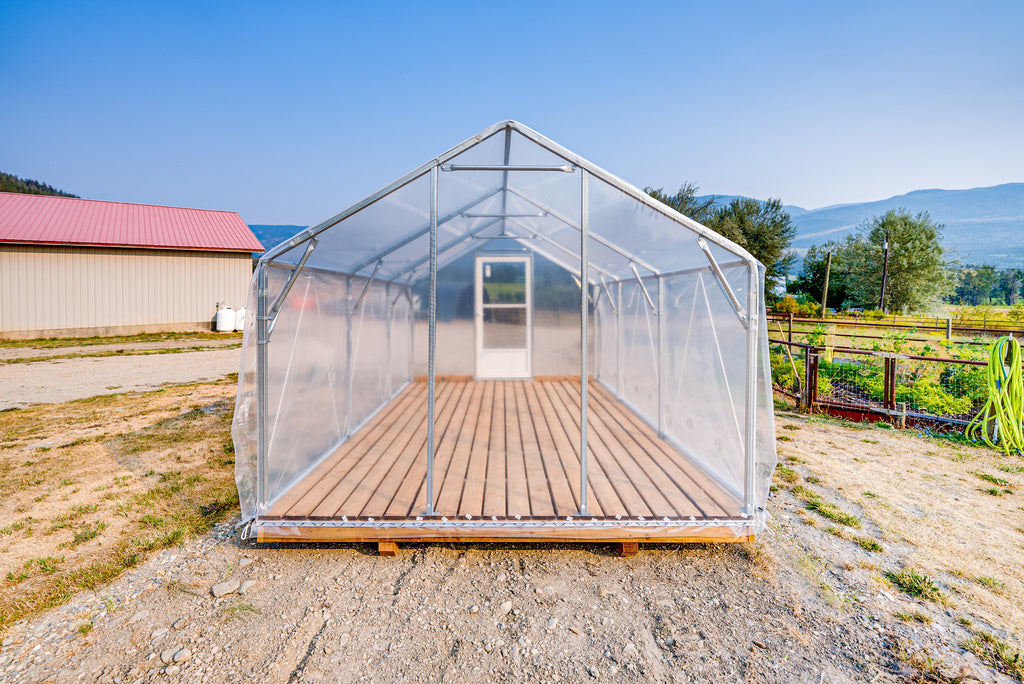 Sprout greenhouse with poly film roof and plank deck, door open