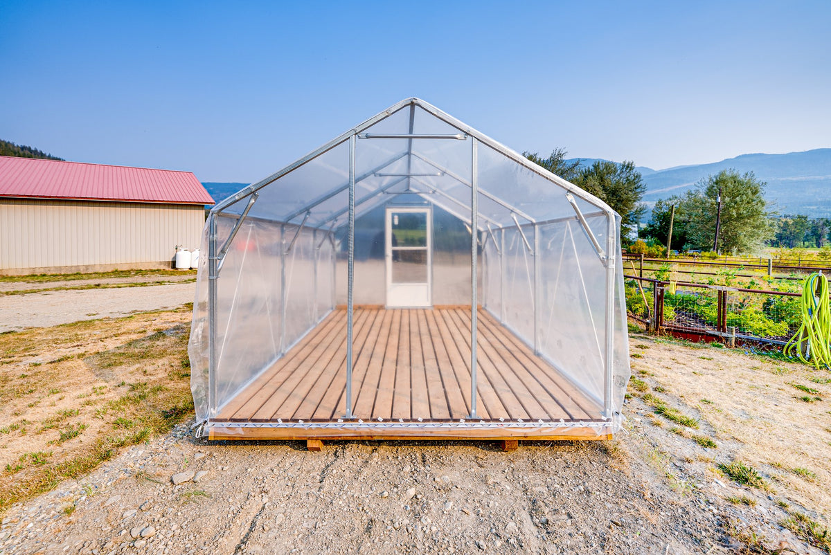 Sprout greenhouse with poly film roof and plank deck, door open