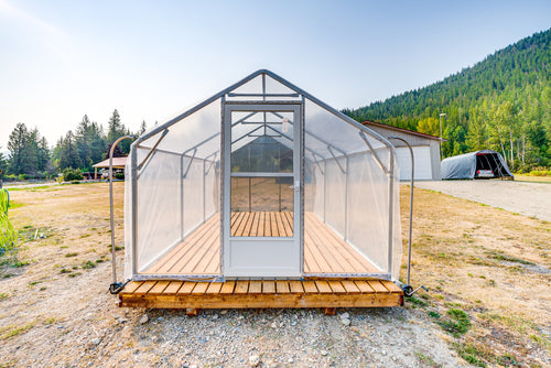 Front view of the Sprout greenhouse with mountains behind