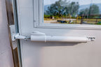 Automatic temperature-triggered window opener