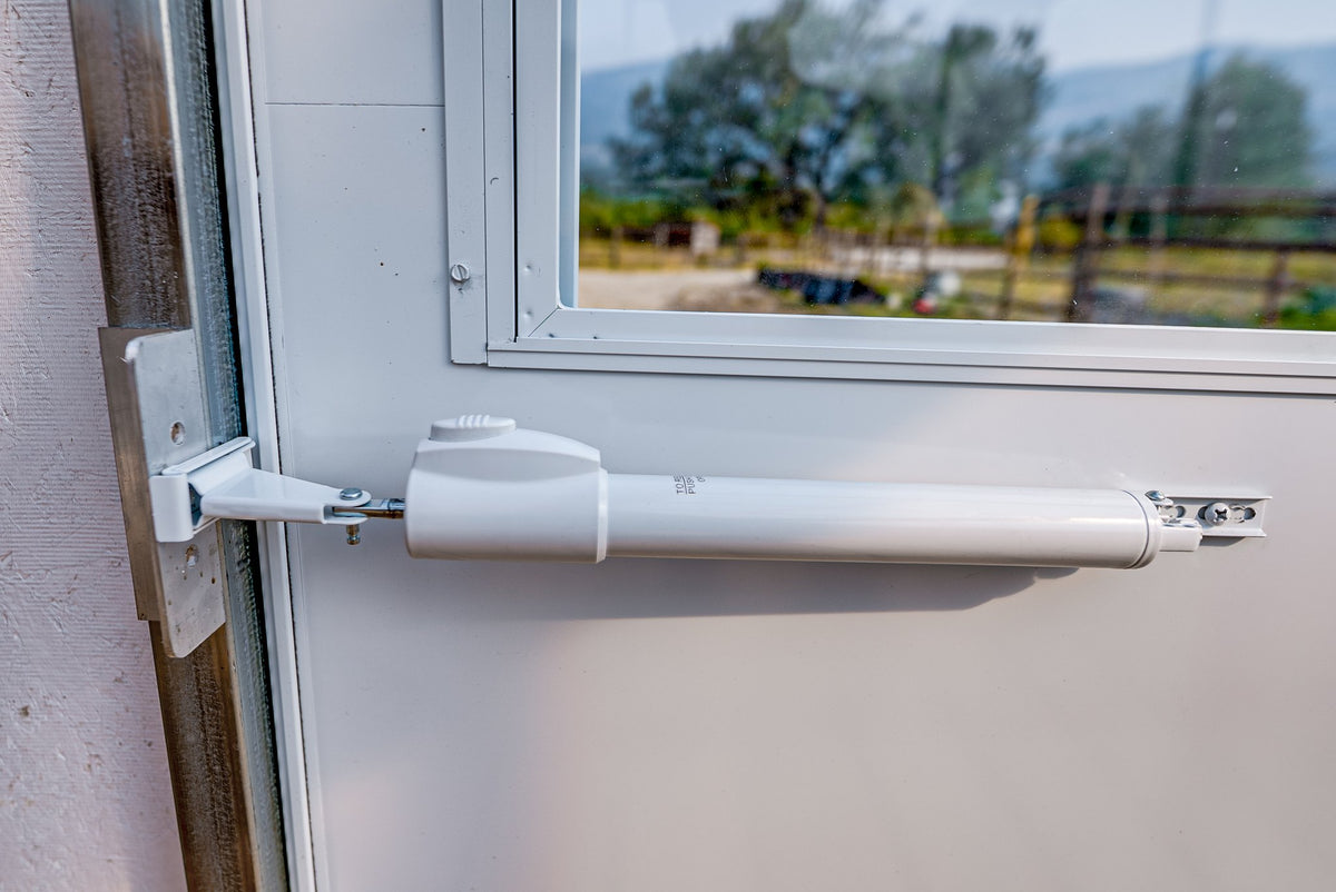 Automatic temperature-triggered window opener