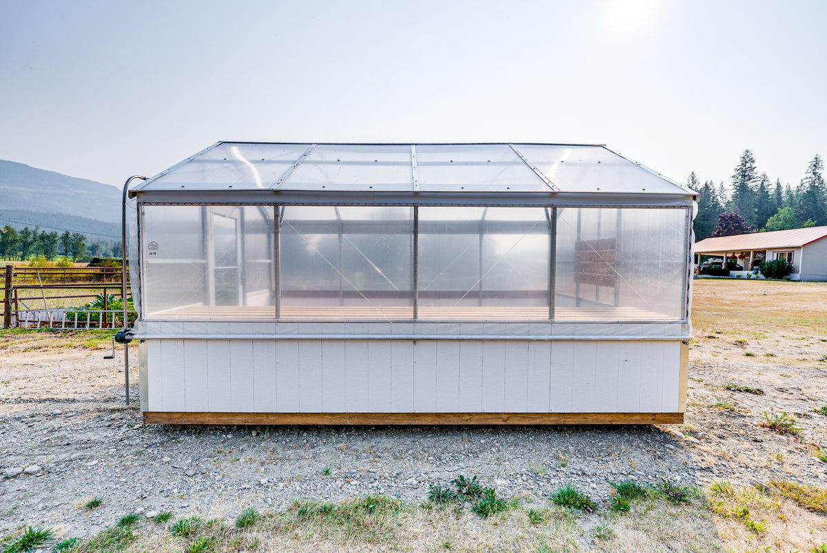 Side view of the Harvest greenhouse showing roll-up ventilation sides