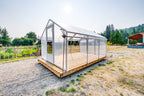 Sprout greenhouse from the front corner showing the plank deck