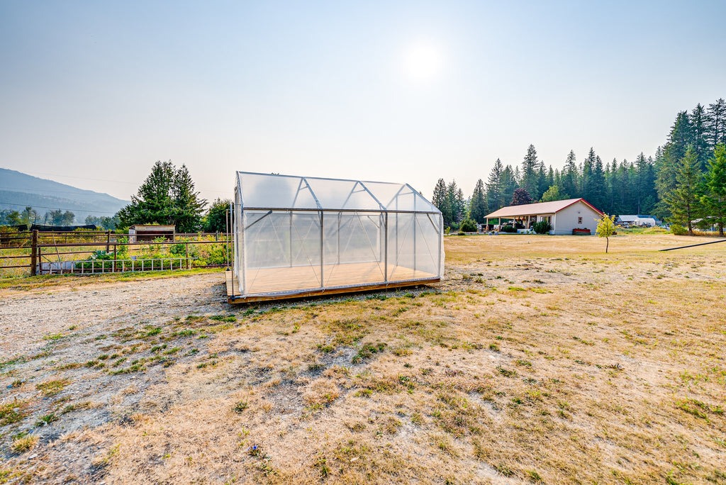 Sprout greenhouse sited in an open Shuswap yard