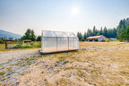 Sprout greenhouse sited in an open Shuswap yard