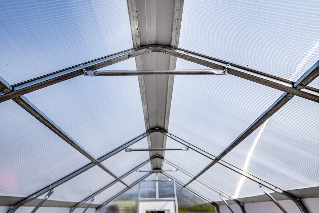 Polycarbonate roof panels and galvanized steel frame inside the Harvest