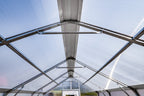 Polycarbonate roof panels and galvanized steel frame inside the Harvest